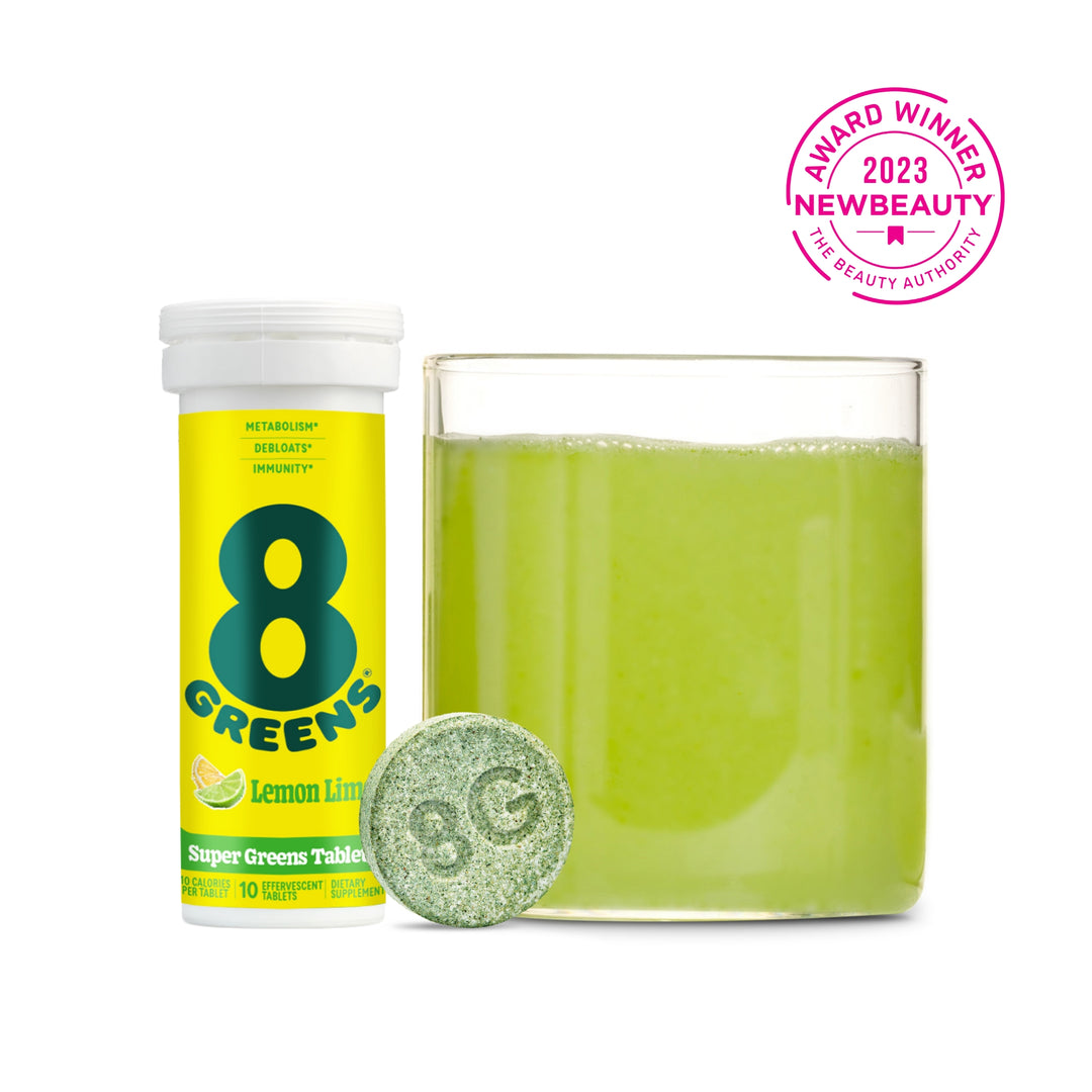 8Greens Super Greens Tablets with tablet and green drink prepared in glass