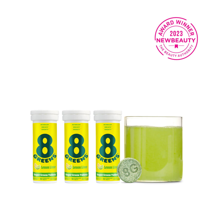 3 packs on Super Greens Tablets, one tablet and green drink prepared in glass in flavor lemon lime